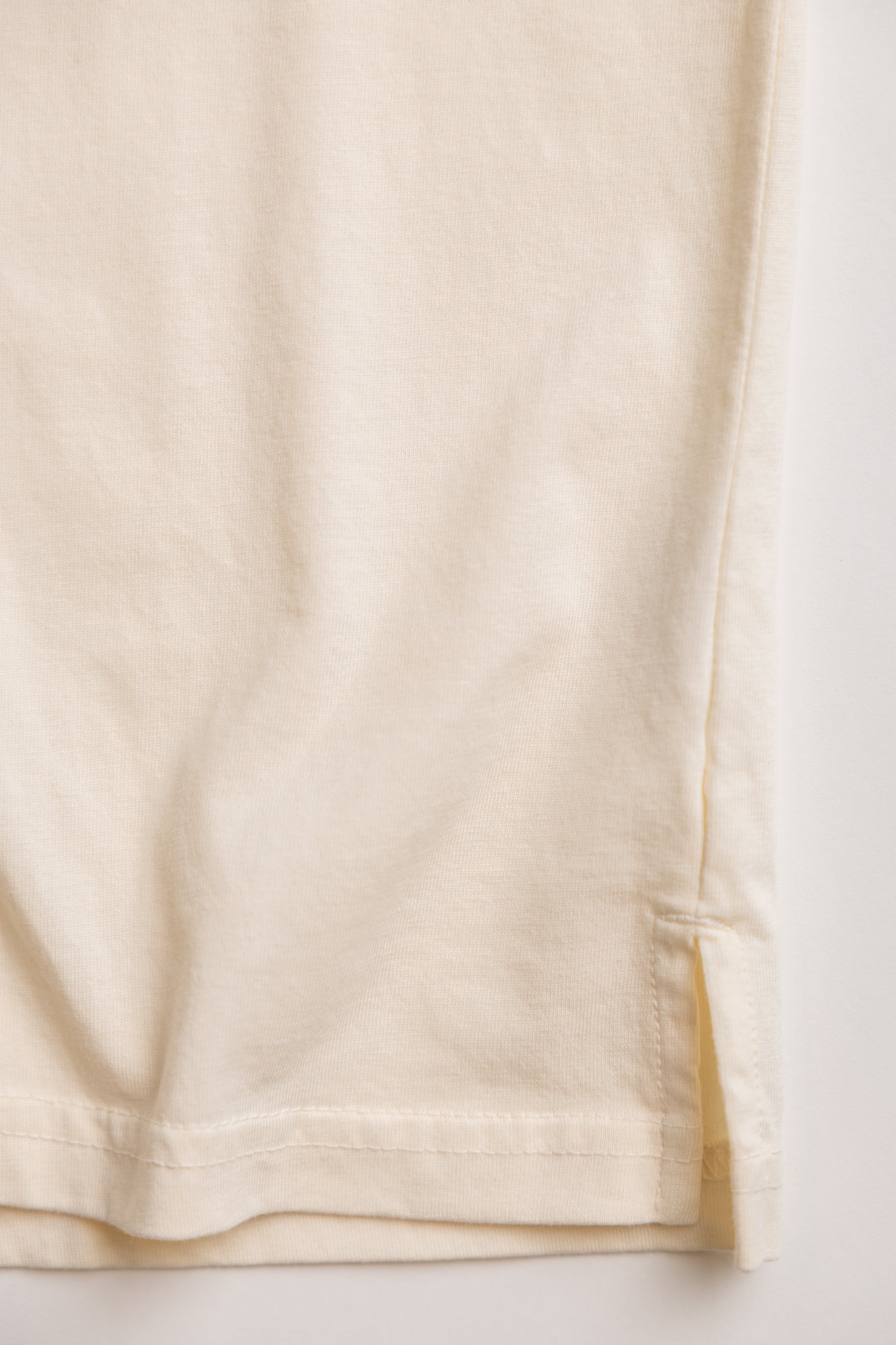 close up shot of natural color tshirt made of regenerative organic cotton