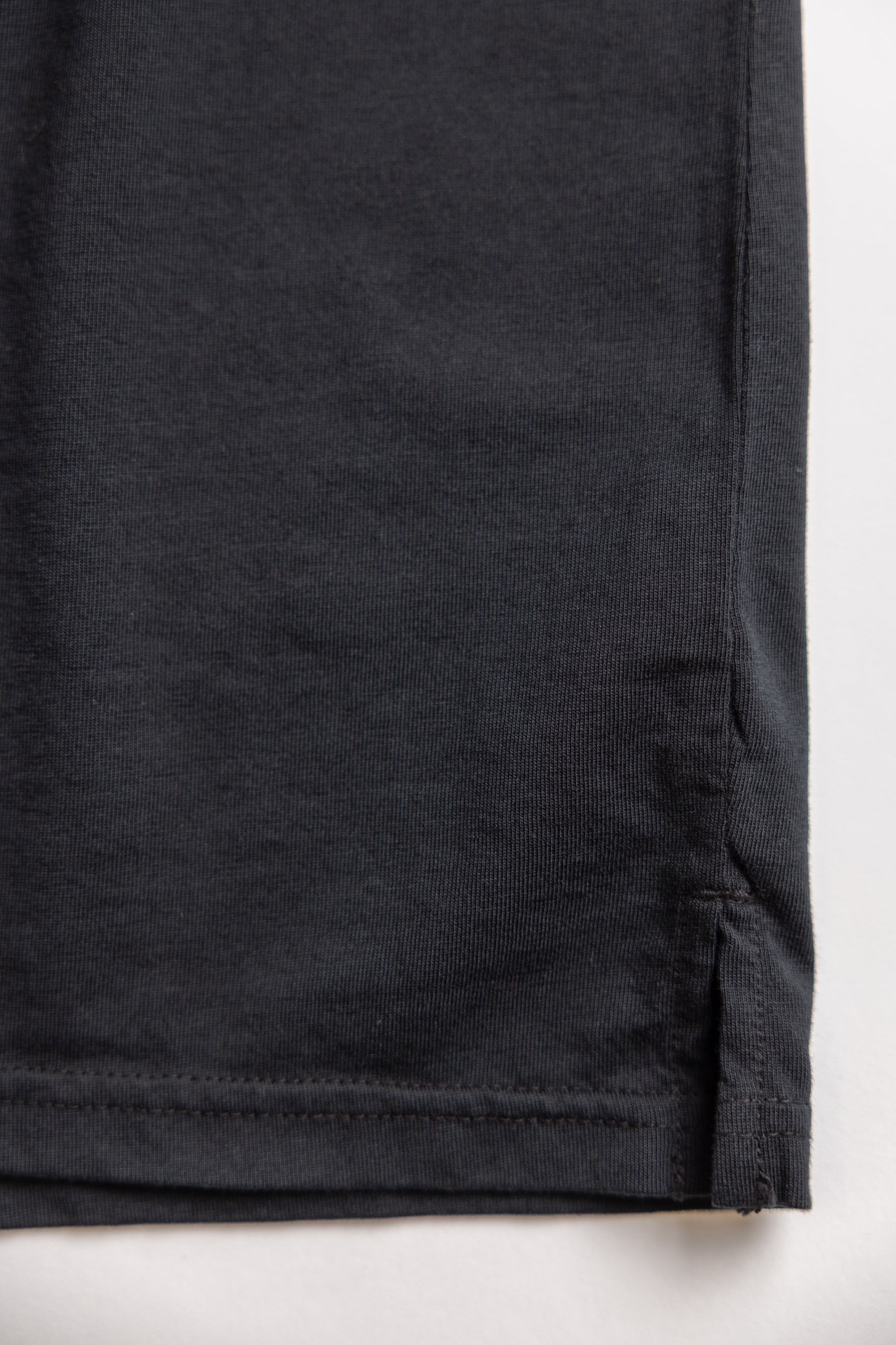Close-up of a black color organic cotton tshirt fabric from Vottera