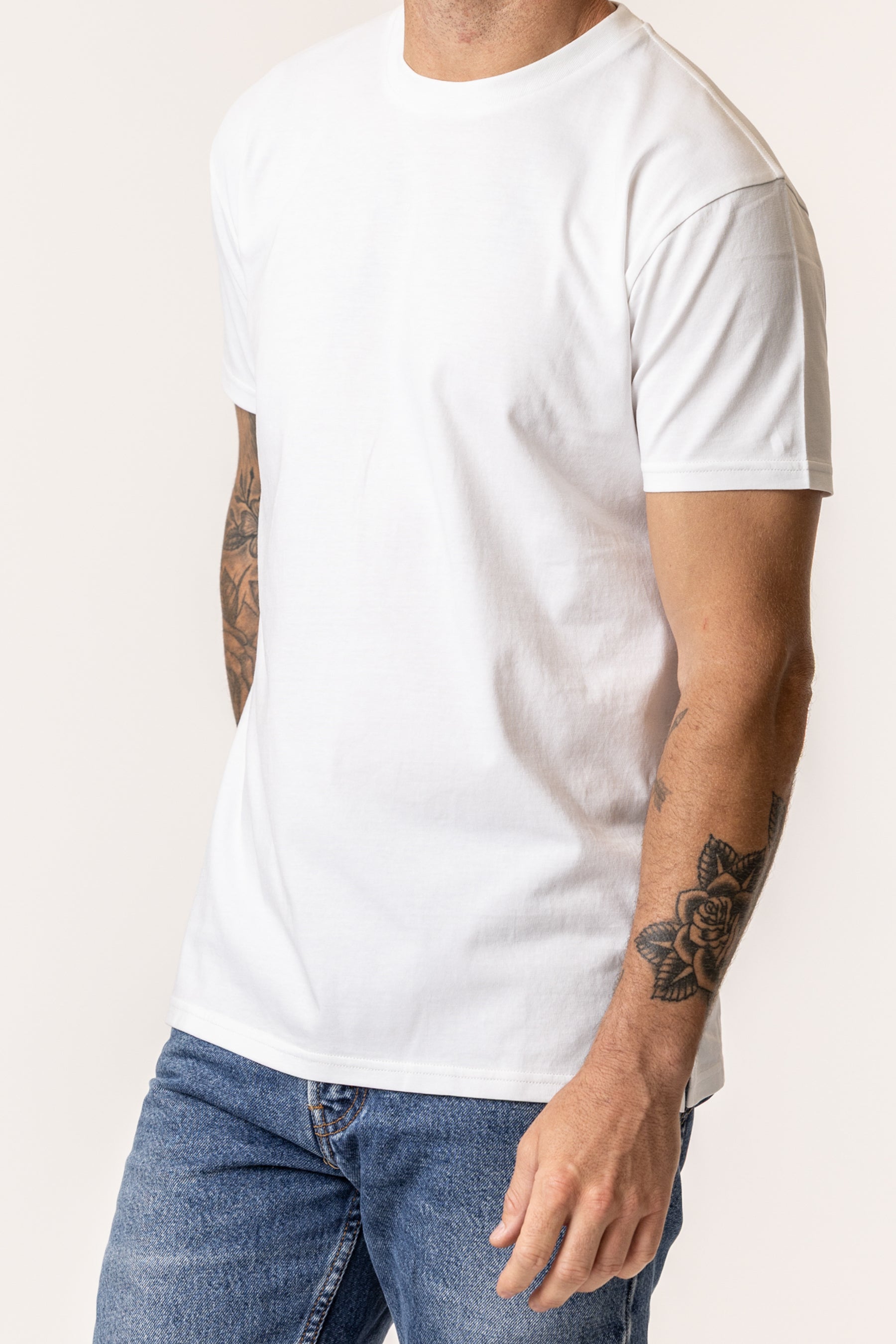close up shot of man wearing white tshirt made of organic cotton