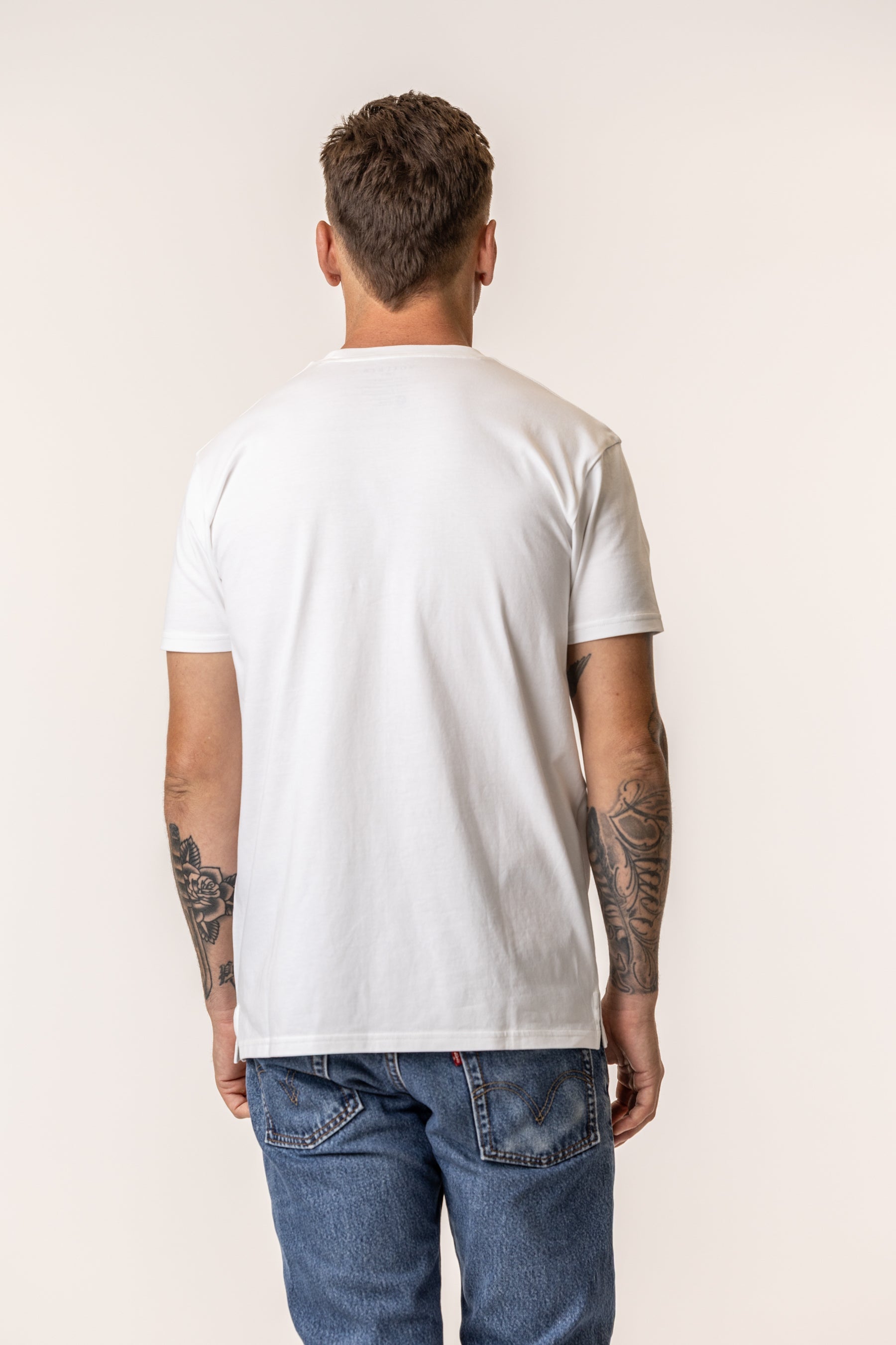 back view of a person wearing a white tshirt