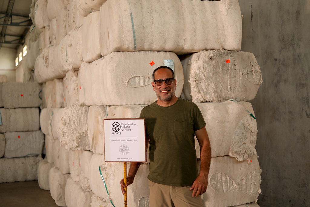 Co founder of Terra Thread standing infront of Regenerative Organic Certified®