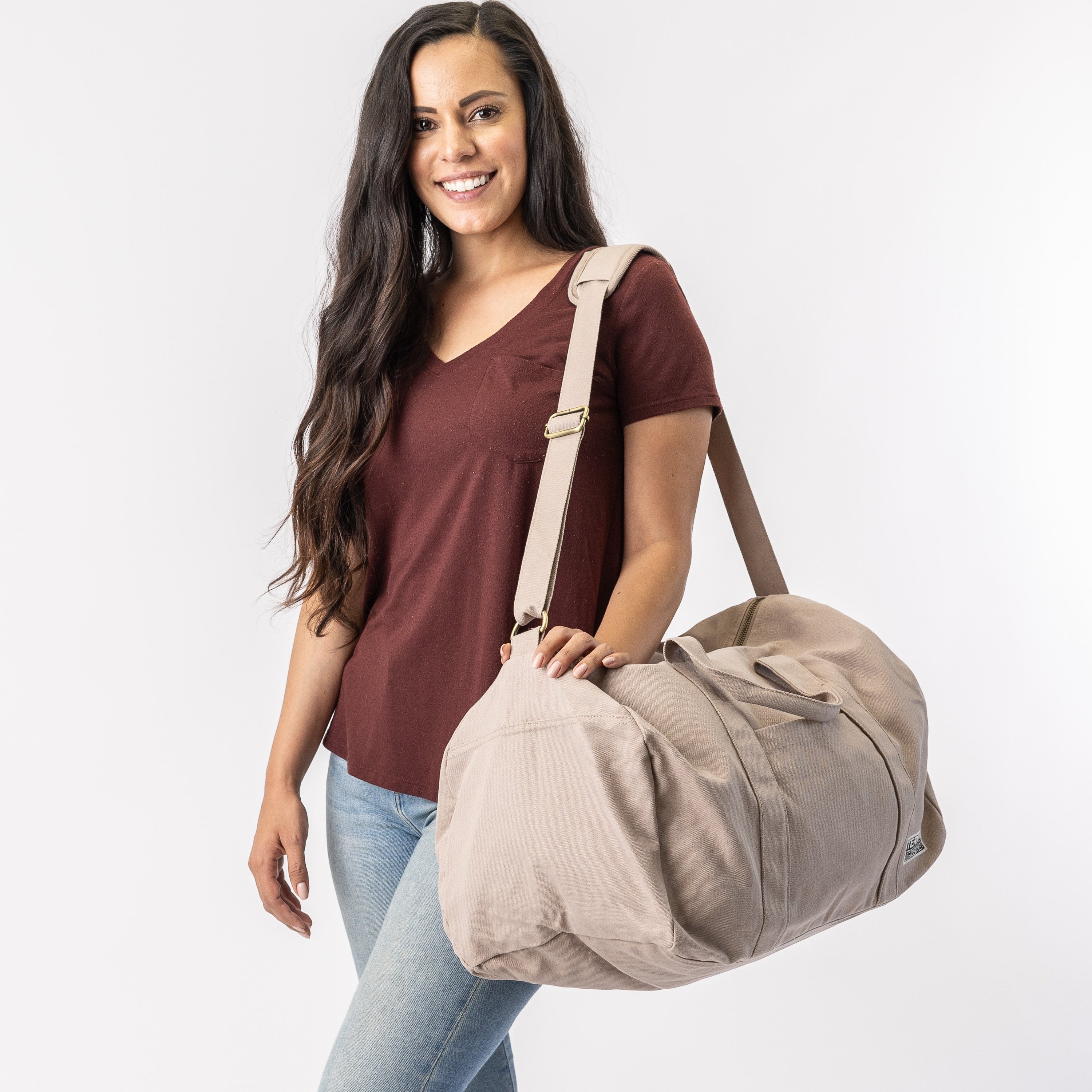 beige duffle bag