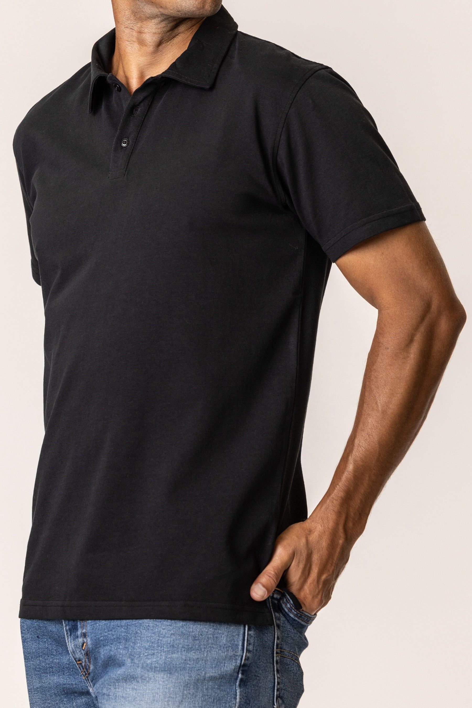 Person wearing a black polo shirt