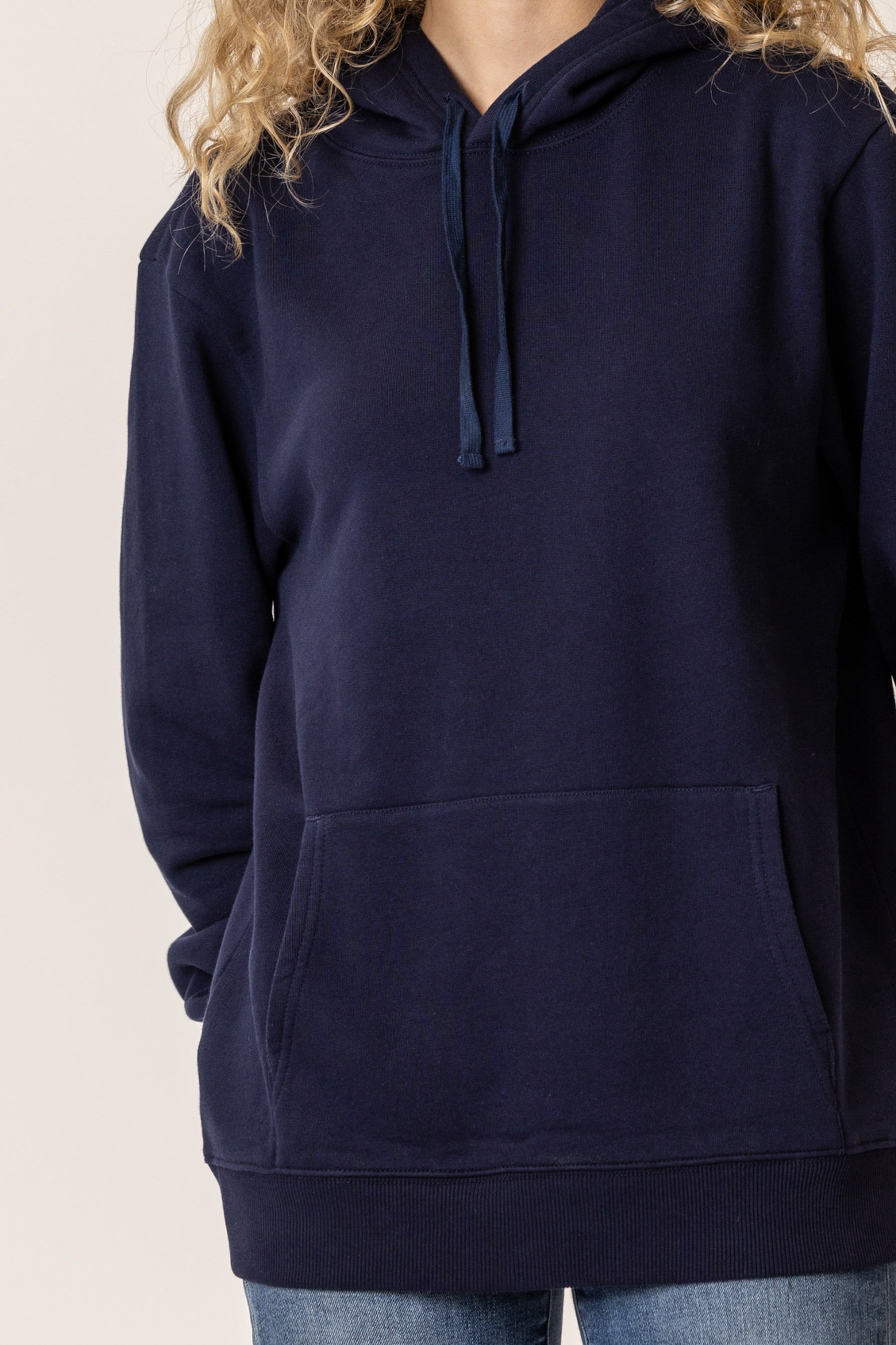 Navy blue cotton hoodie worn by a person