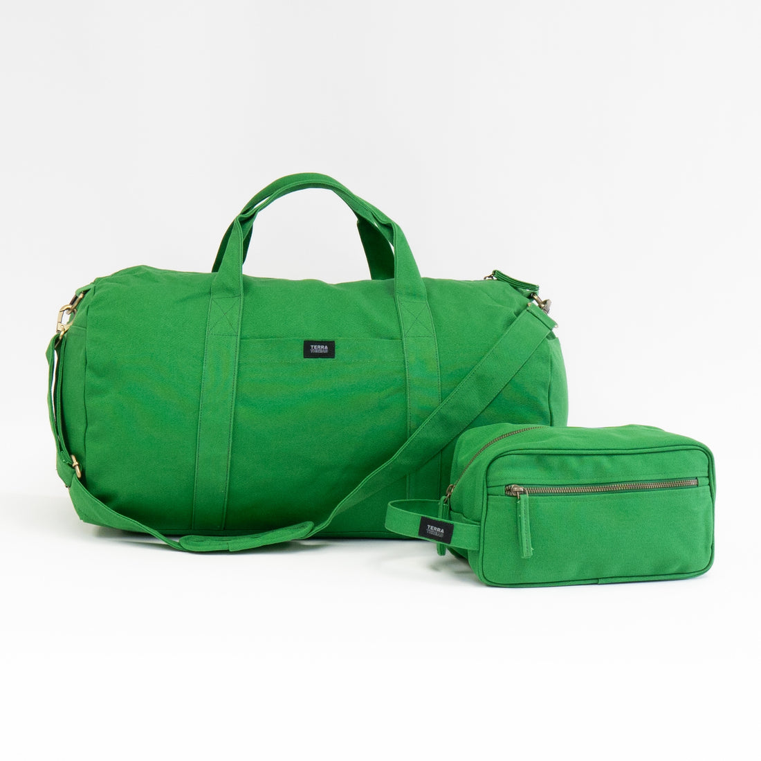 green duffle bag and toiletry bag