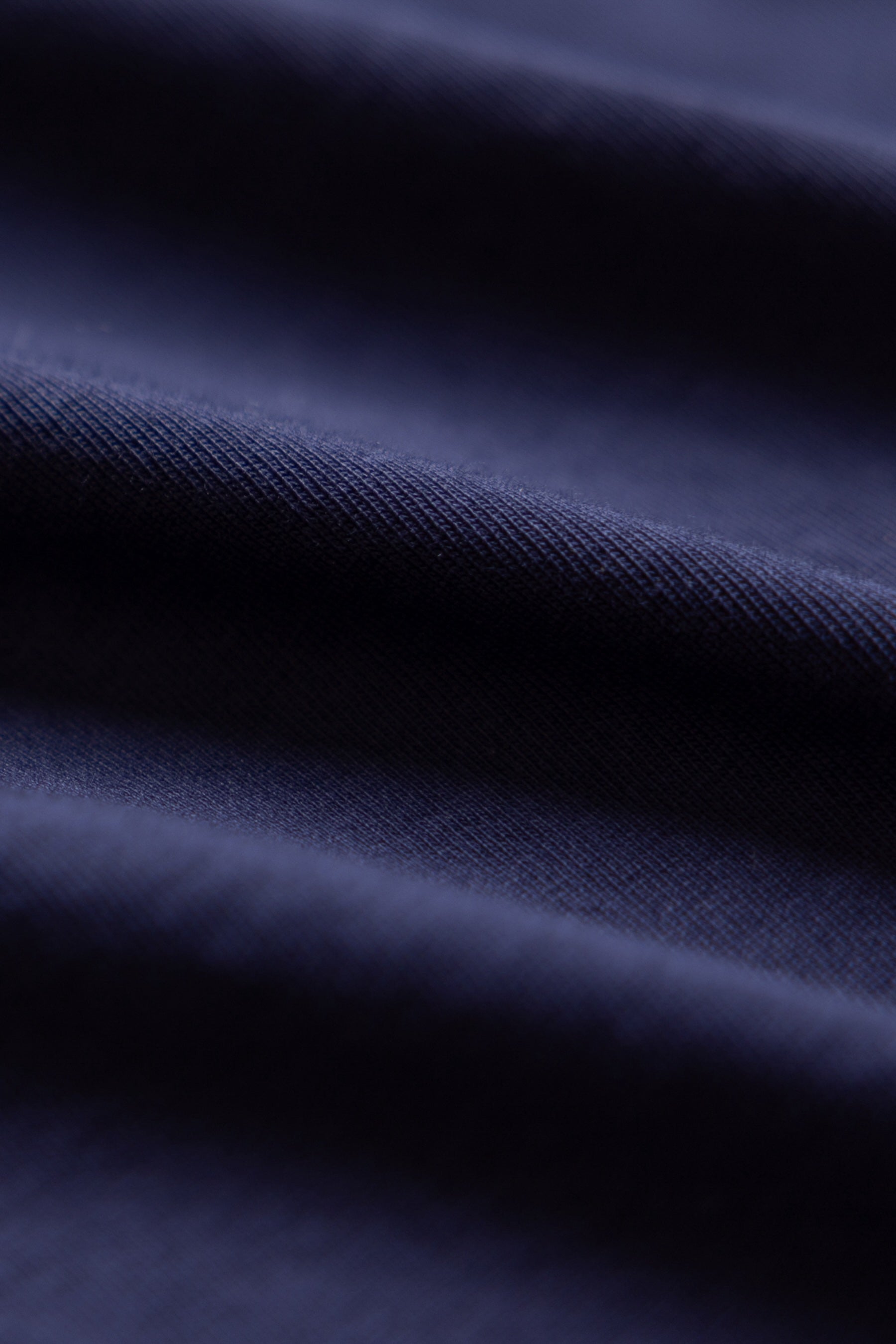 close up photo of navy blue color tshirt made of regenerative organic cotton