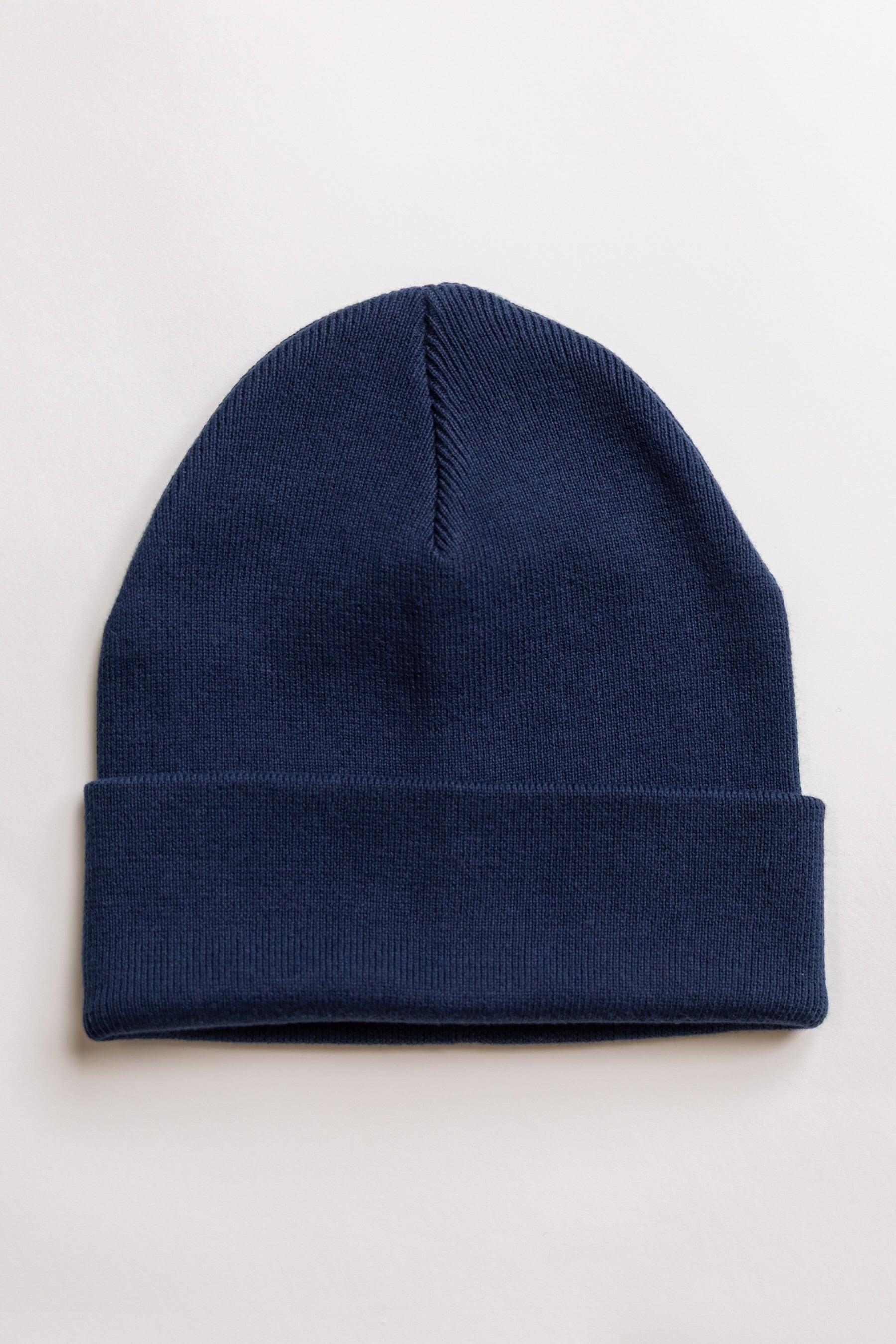organic cotton Navy blue beanie on a light gray background
