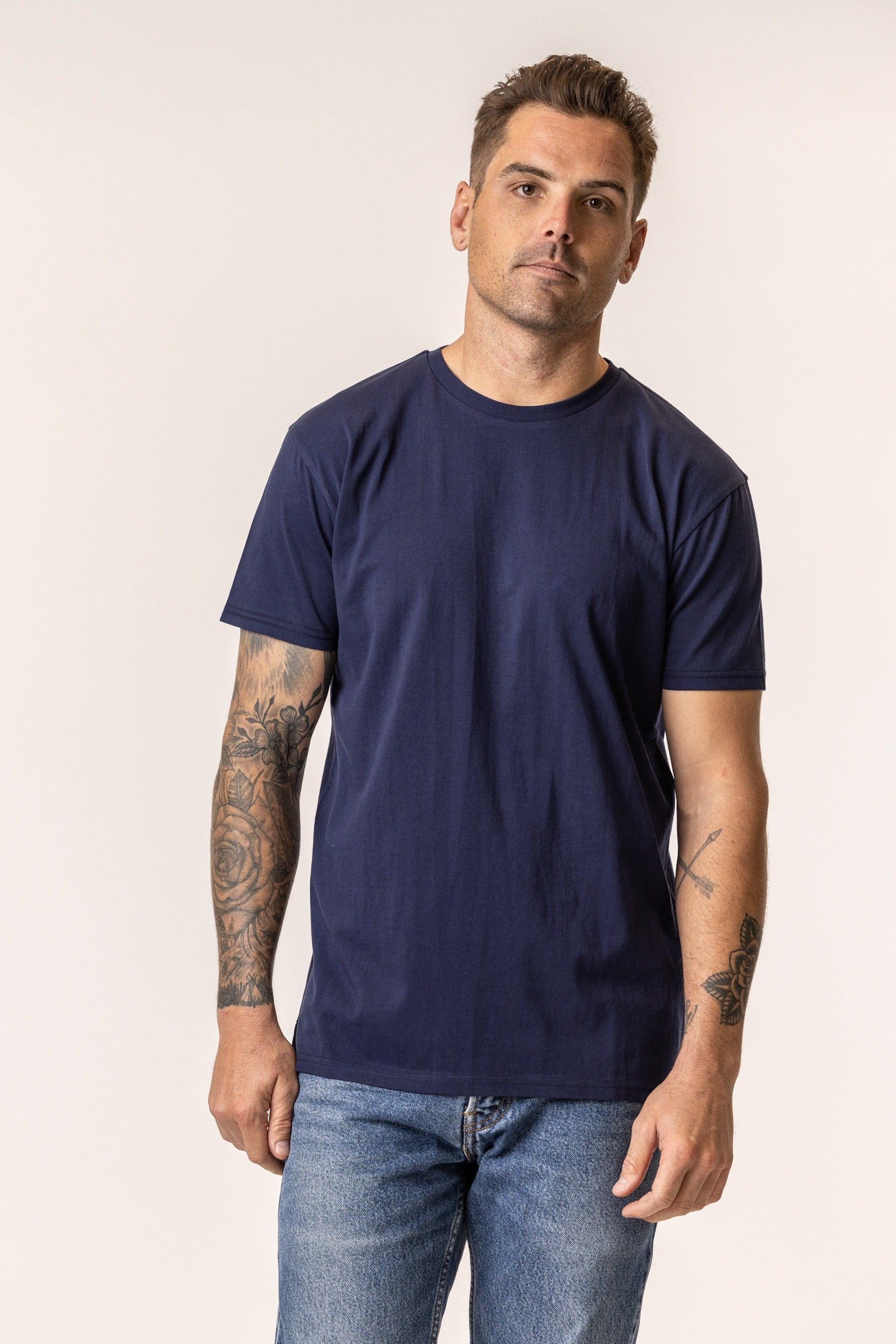 man wearing regenerative organic cotton navy blue tshirt from vottera