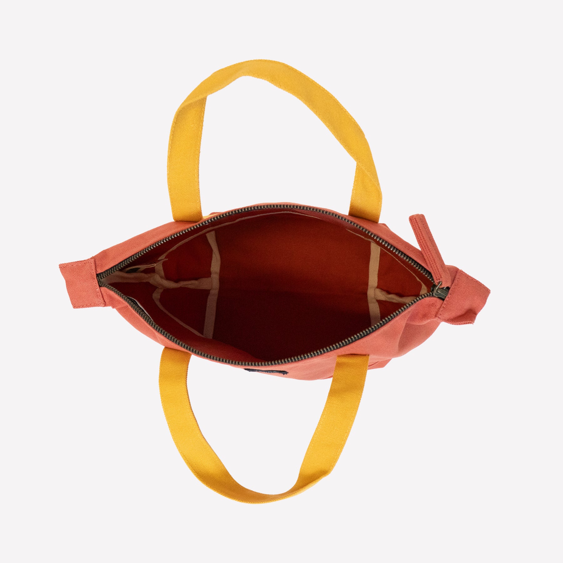 An inside view of organic cotton canvas mini tote bag in orange color with yellow handle