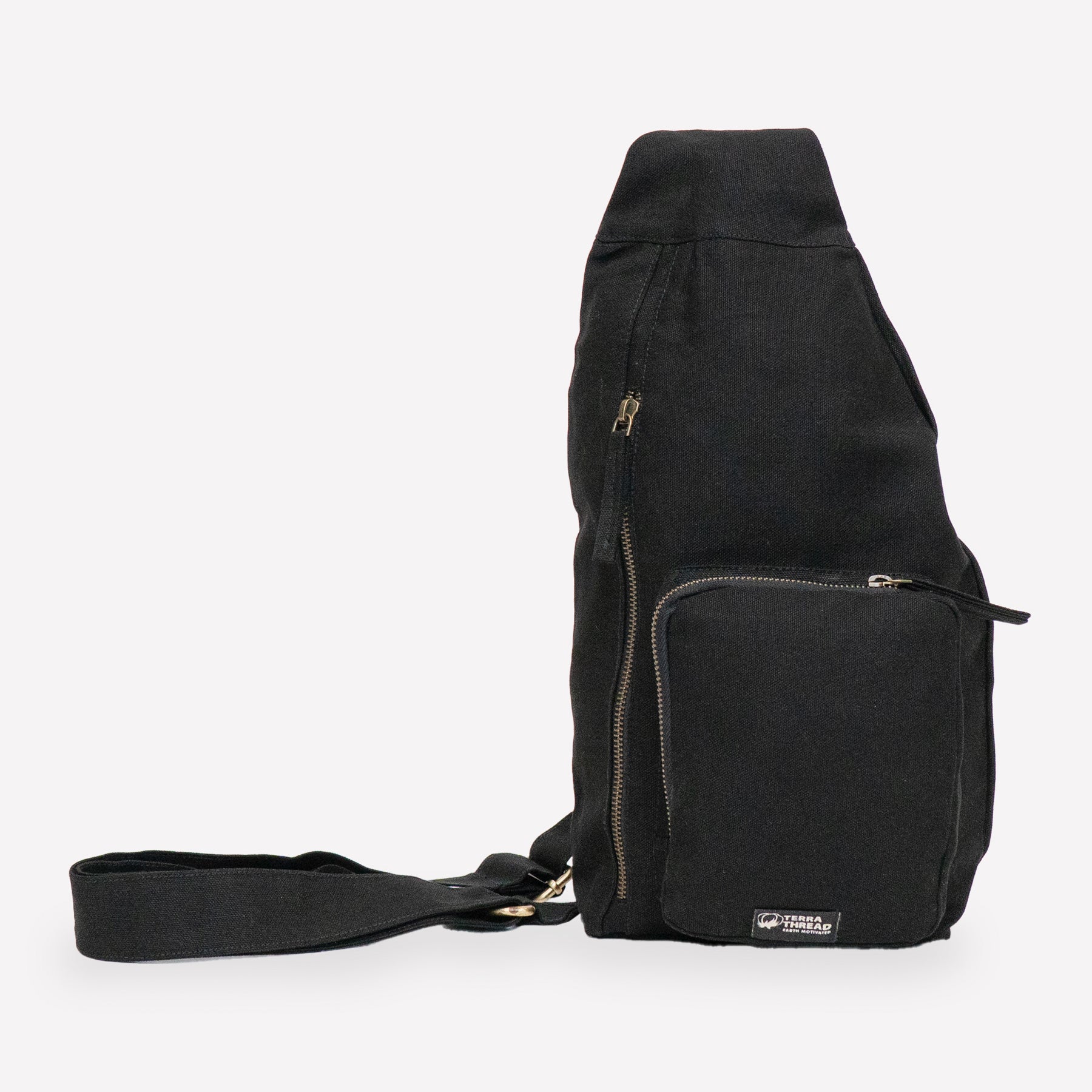 A black canvas sling bag made with organic cotton