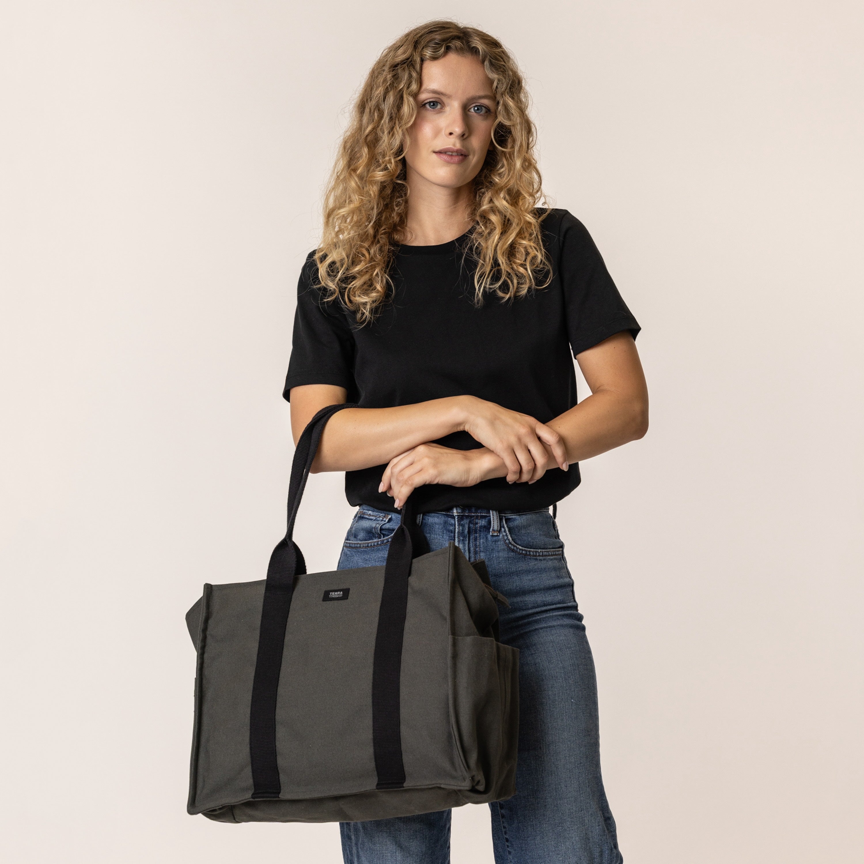 Woman holding a sustainable handbag