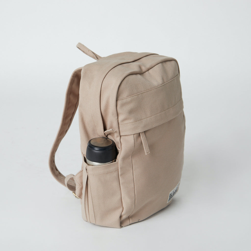 beige school backpack