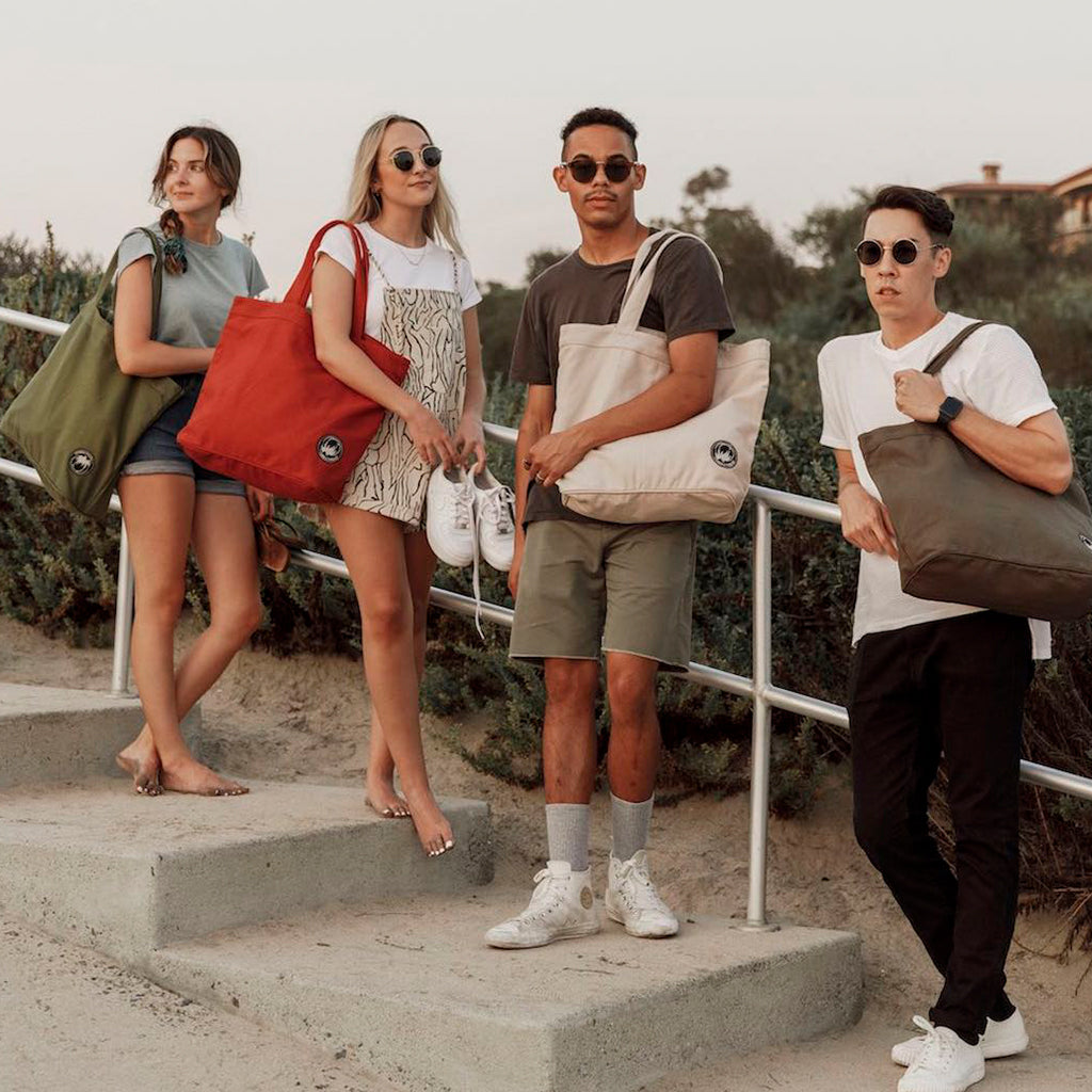 Models carrying Terra Thread Tote Bags 