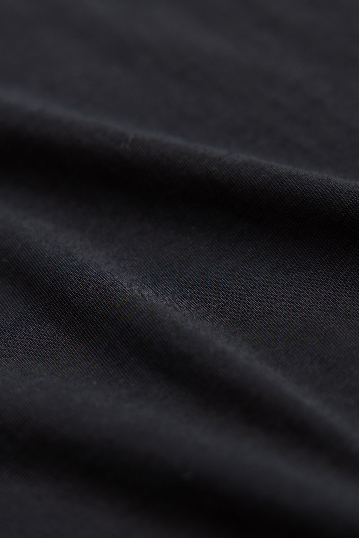 close up shot of black color polo shirt