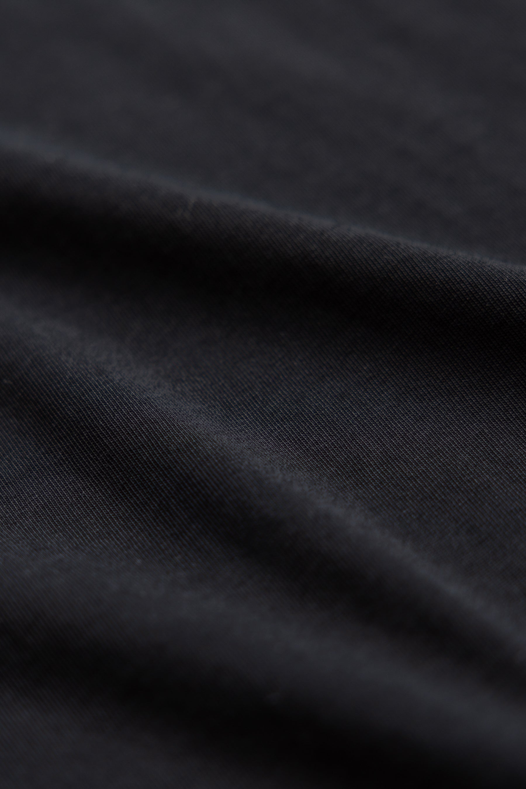 close up shot of black color polo shirt