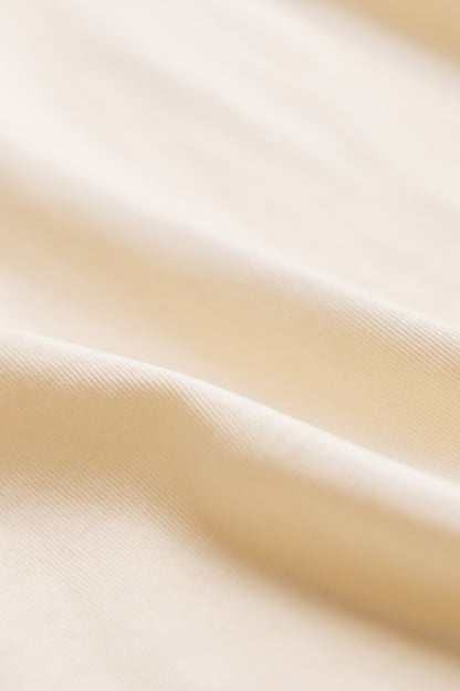 Close-up of natural color polo shirt