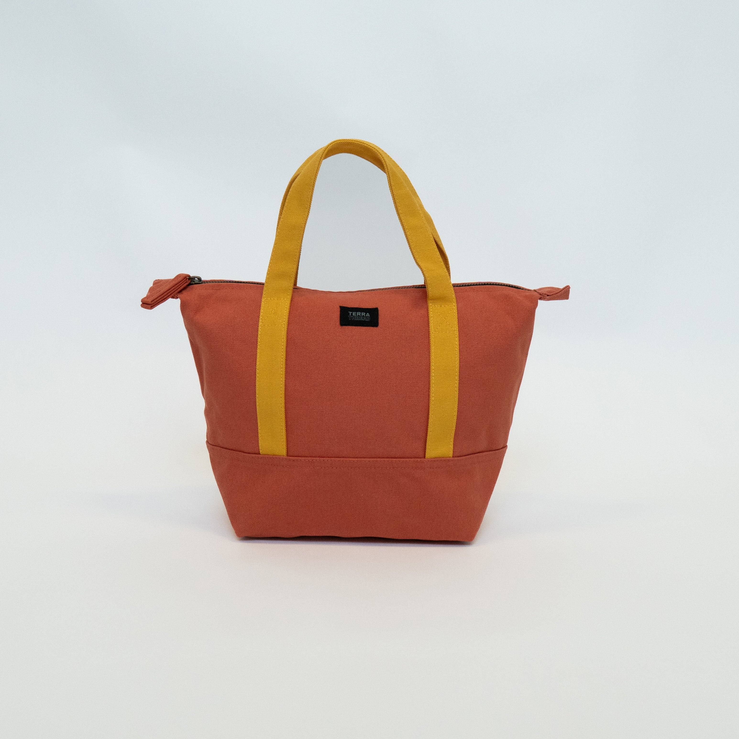 Mini canvas tote bag in orange color made from organic cotton