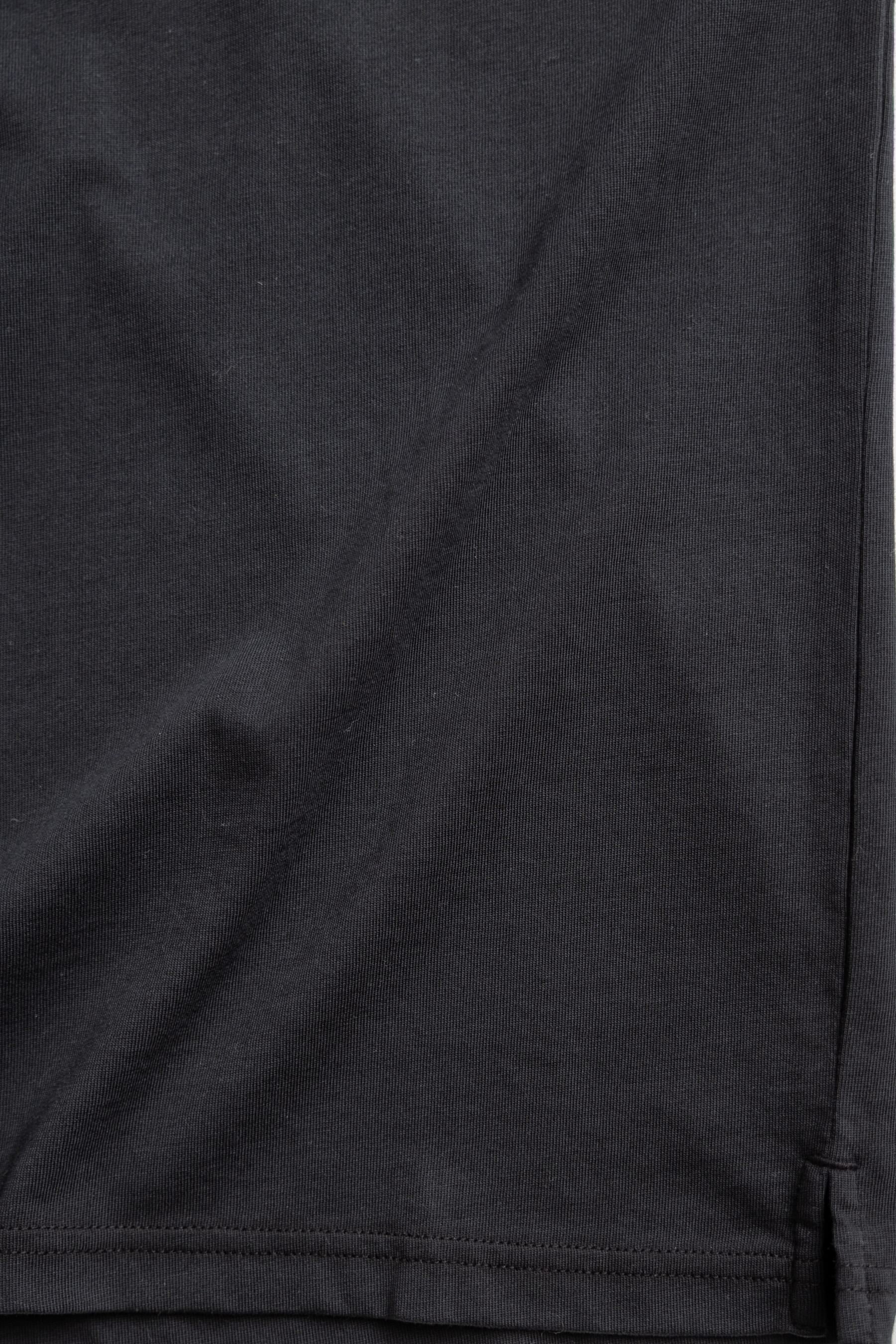 close up photo of polo shirt in black color