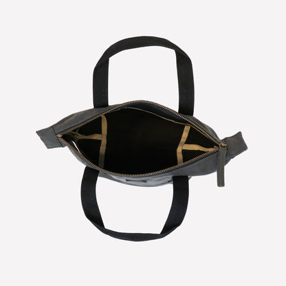An overhead view of a dark gray mini tote bag with black handles
