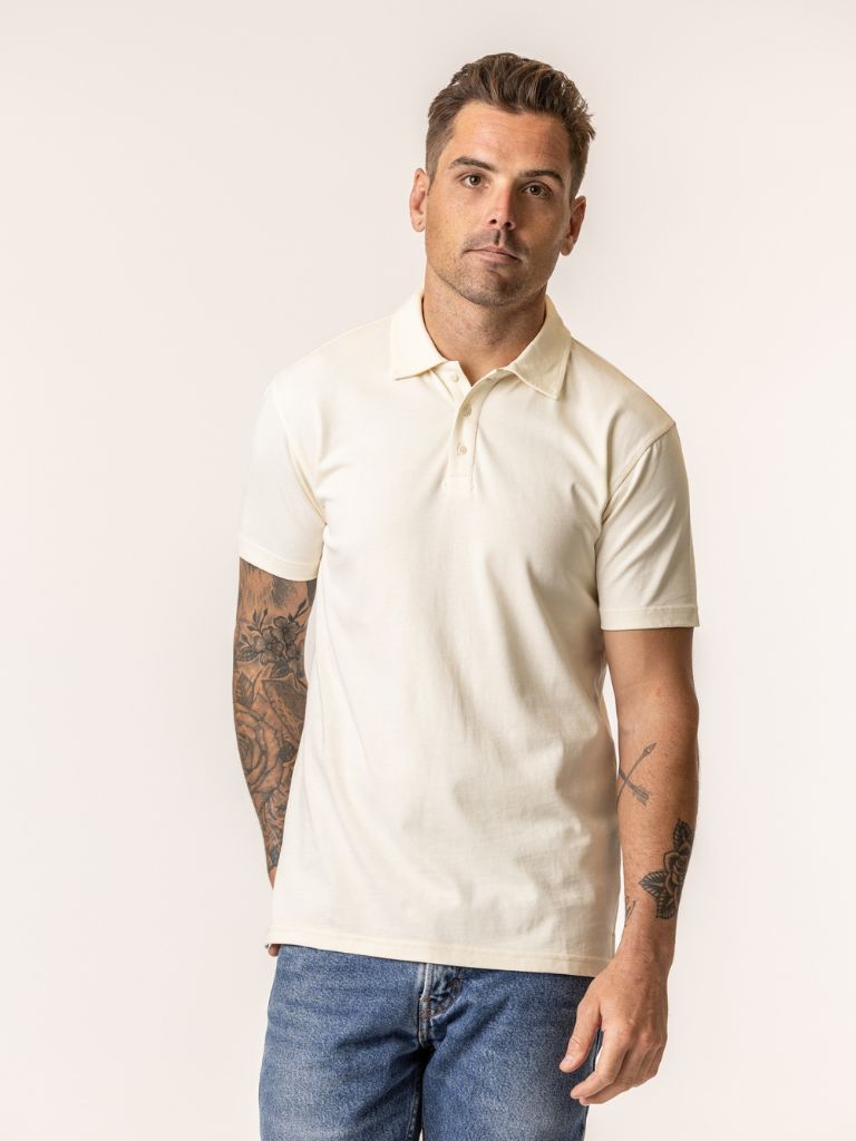 Man wearing a natural color organic cotton polo shirt