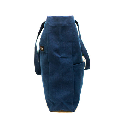 side view of Terra Thread canvas tote bag in navy blue