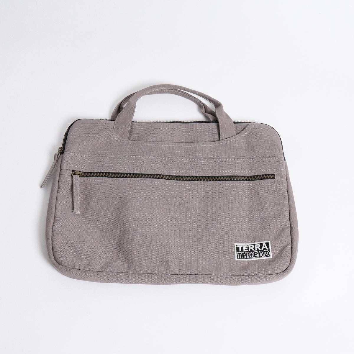 Laptop bag with outlet handle